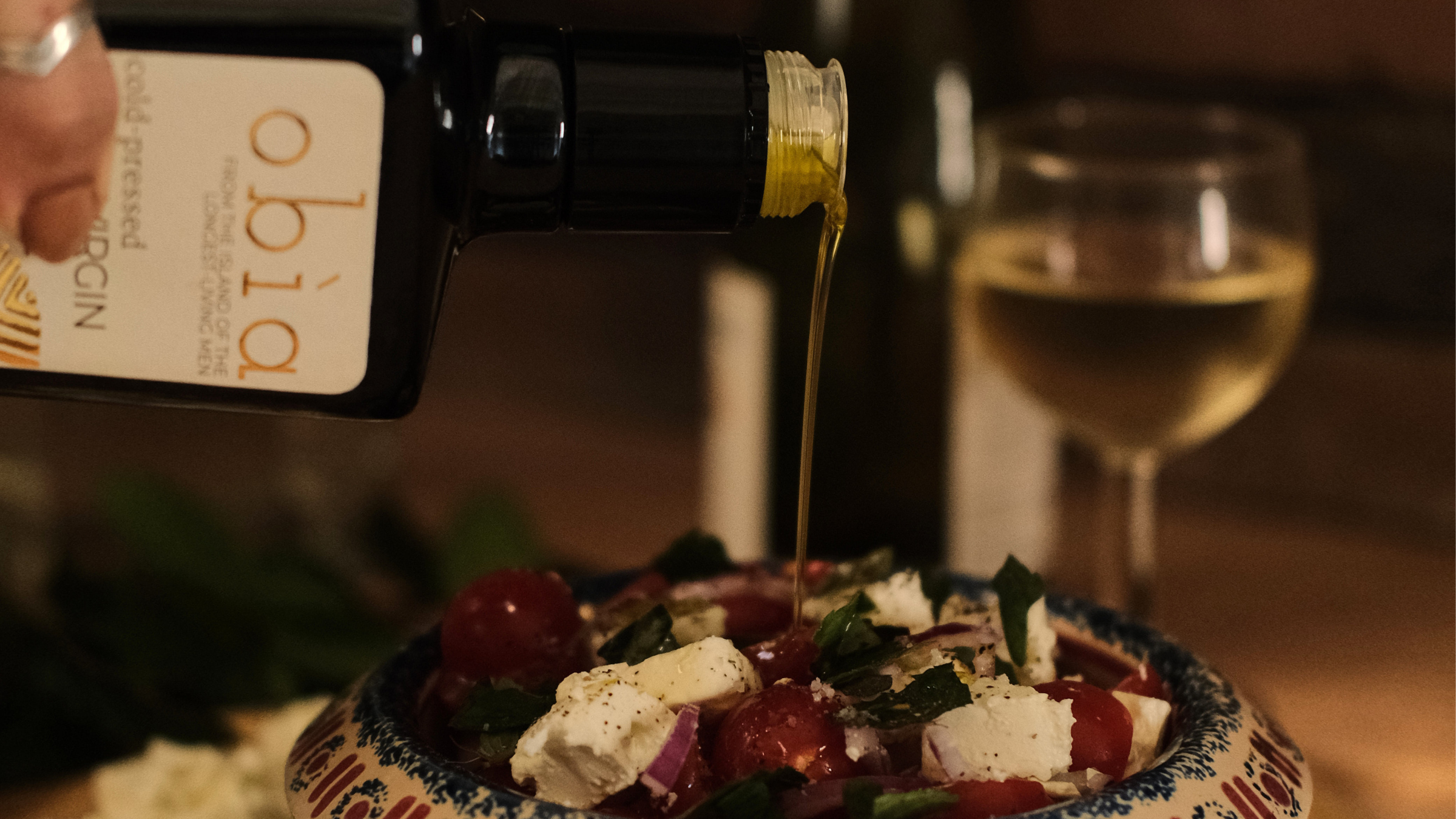 Olive Oil Pouring Over Salad